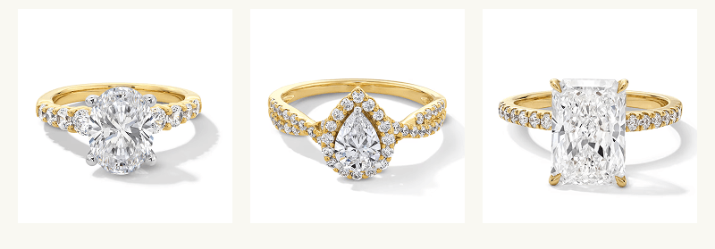 Various shaped diamonds on eternity bands, set in yellow gold metal.