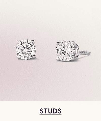 A pair of white metal diamond studs. Click here to shop studs