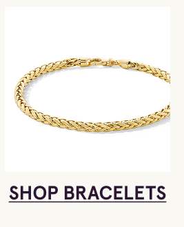A gold braided rope chain bracelet. Click here to shop bracelets