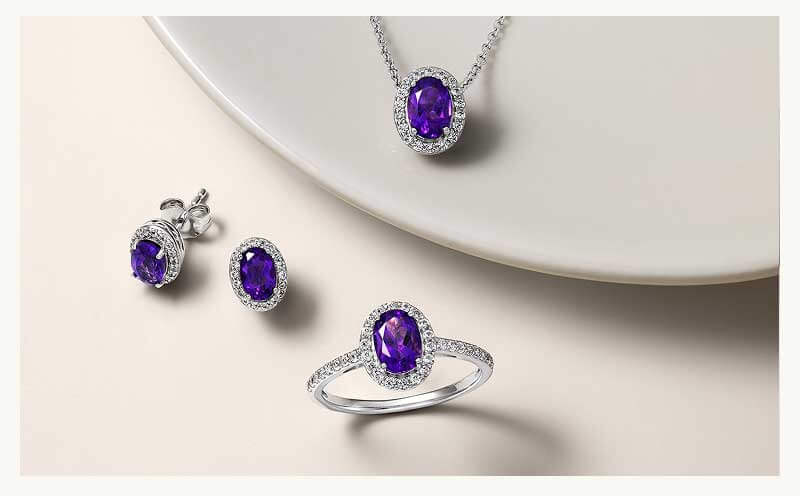 Set of diamond jewelry including studs, pendant chain & ring with amethyst sapphire gemstones.