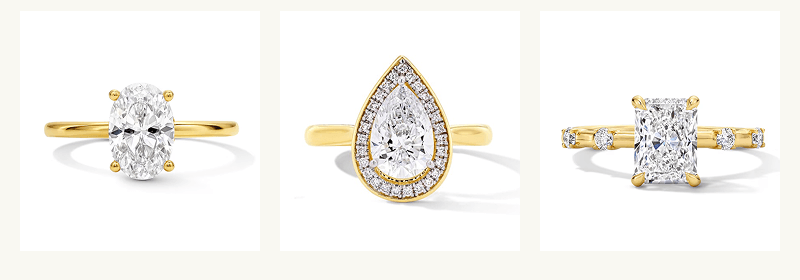 Various shaped diamonds, set on yellow gold bands.