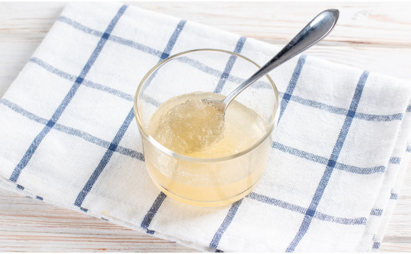 A spoon in a bowl of gelatin