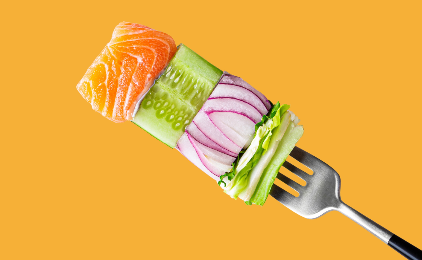 A stack of food on a fork