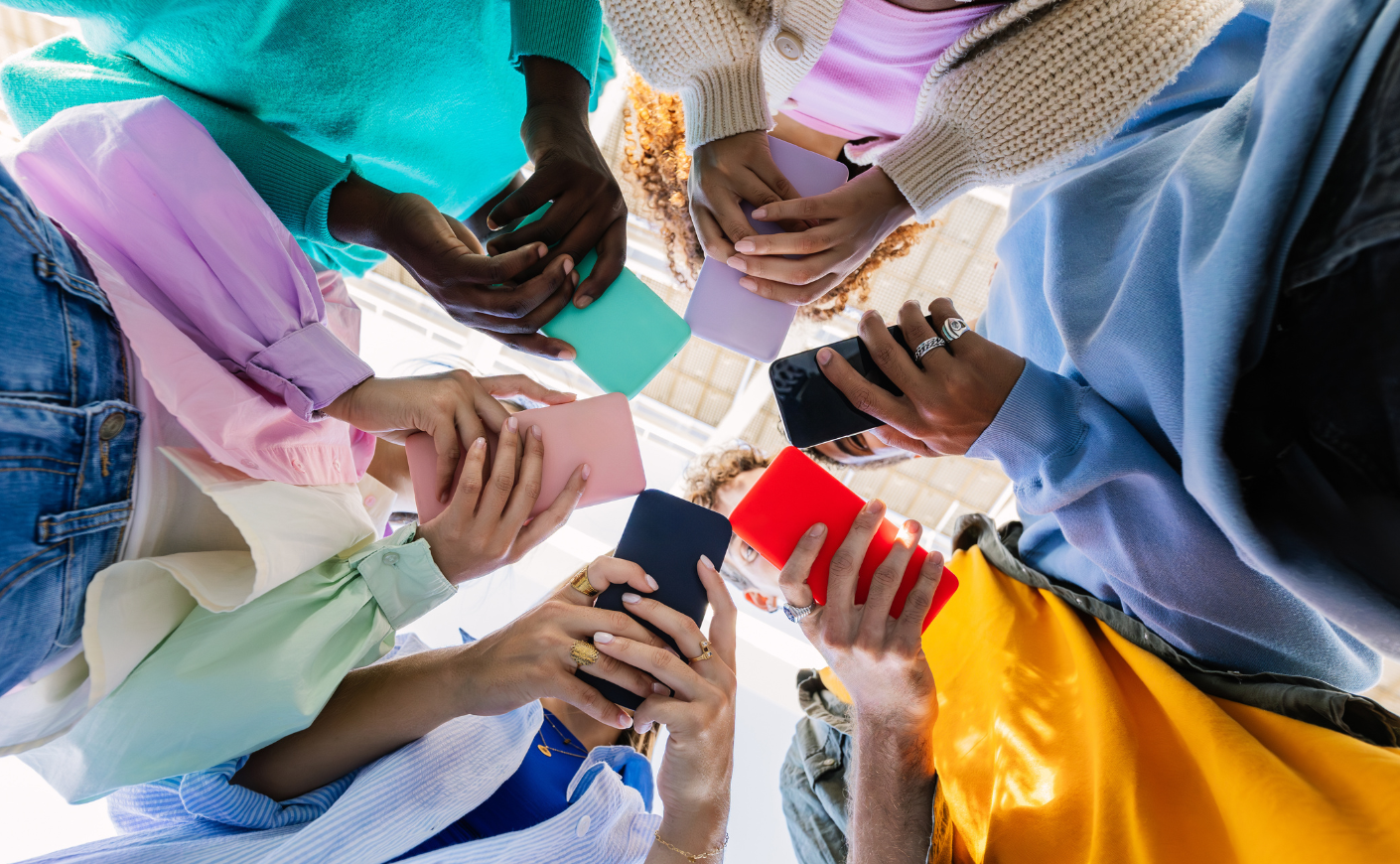 Kids in a circle on their phones