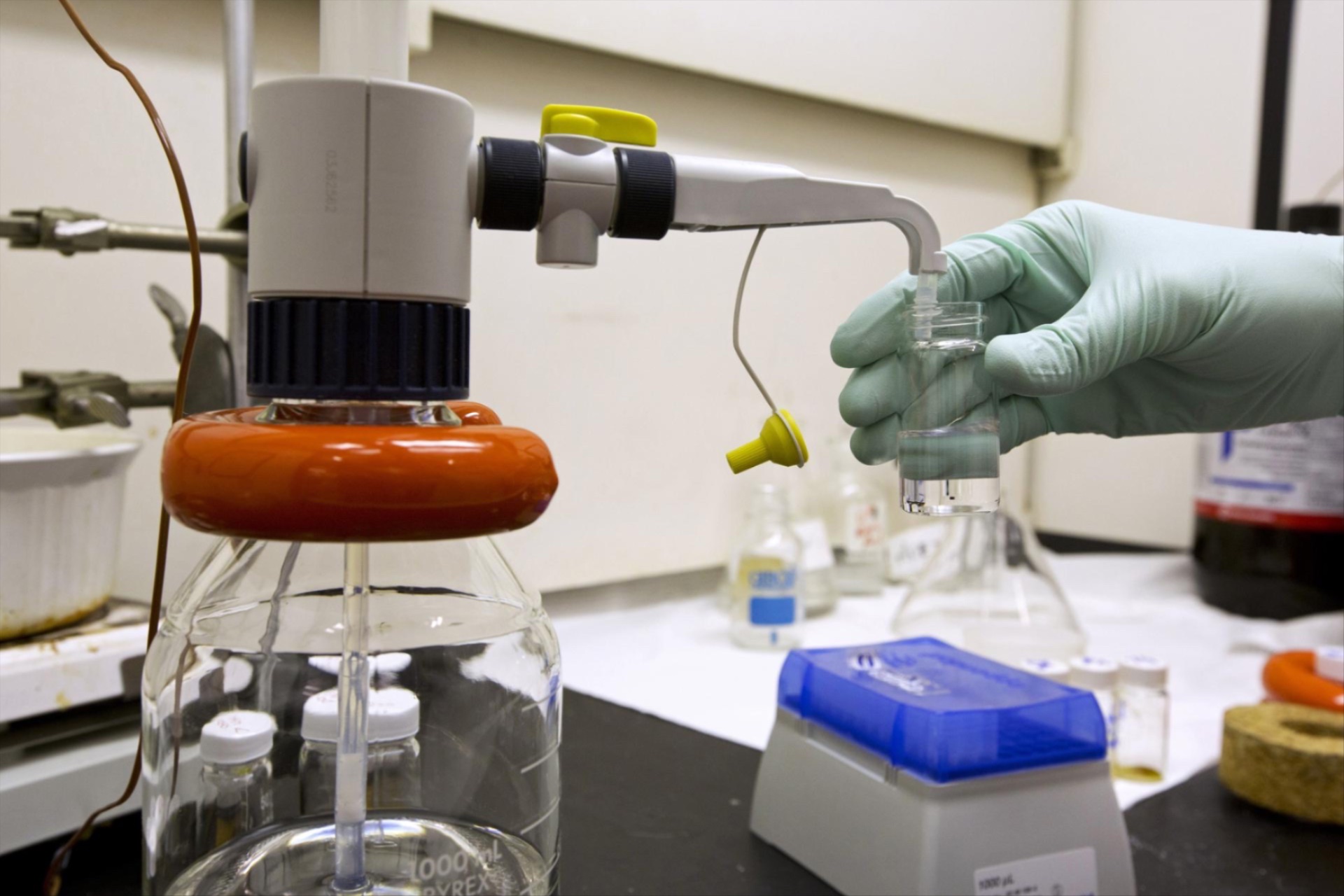 A scientist dispenses organic solvent for use in a lab test on chemical reactions, at the U.S. Food and Drug Administration (FDA) in Silver Spring, Maryland.