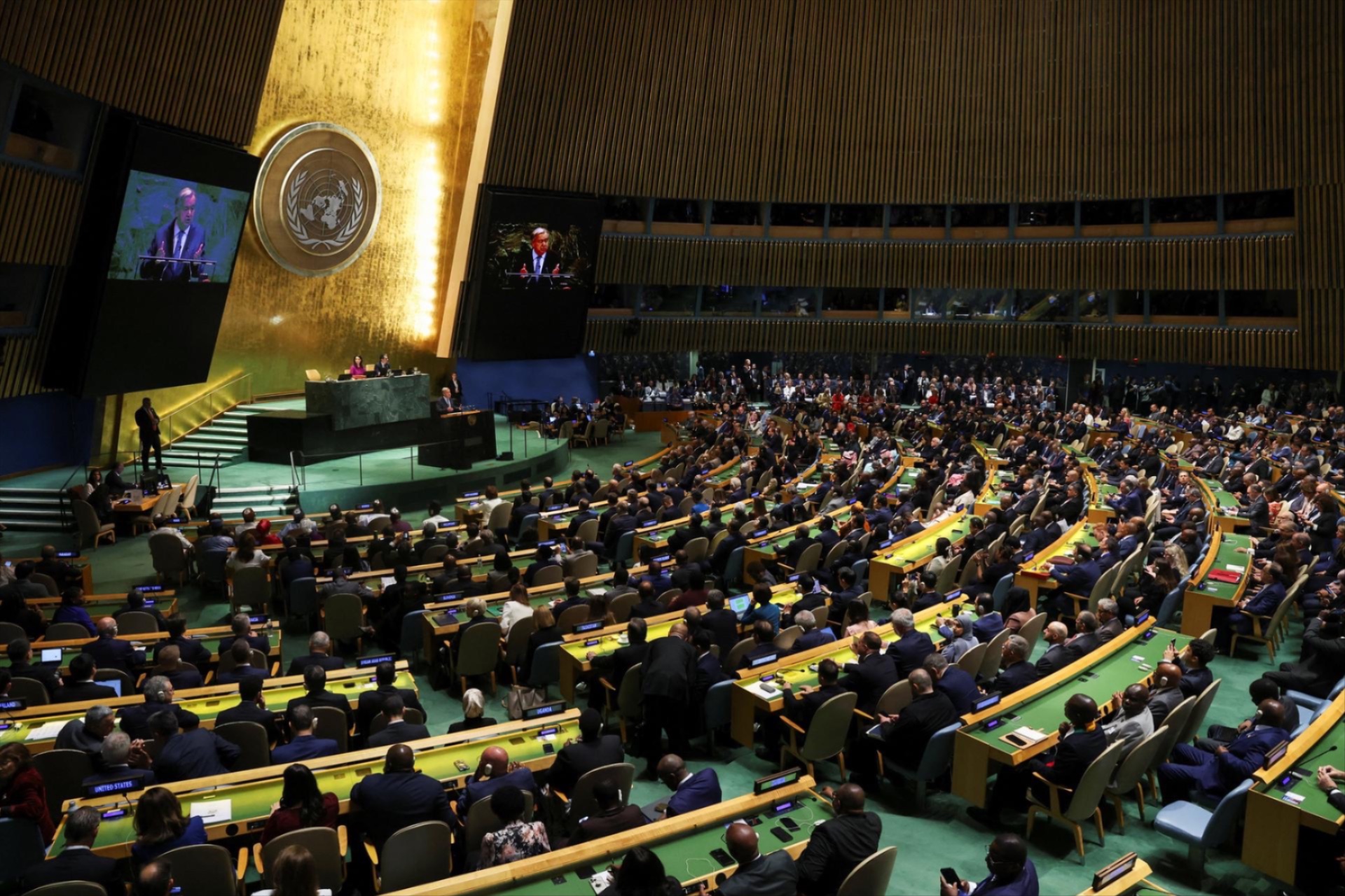 United Nations delegates watch as UN Secretary-General Antonio Guterres addresses the 80th General Assembly at UN headquarters in New York City, September 23, 2025.