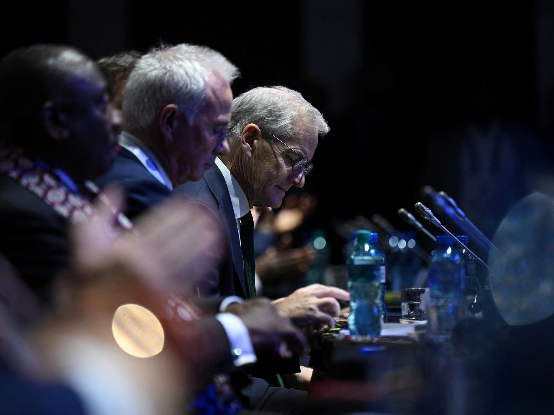 Norway's Prime Minister Jonas Gahr Store listens during the Global Fund event, in Sandton, Johannesburg, South Africa, on November 21, 2025