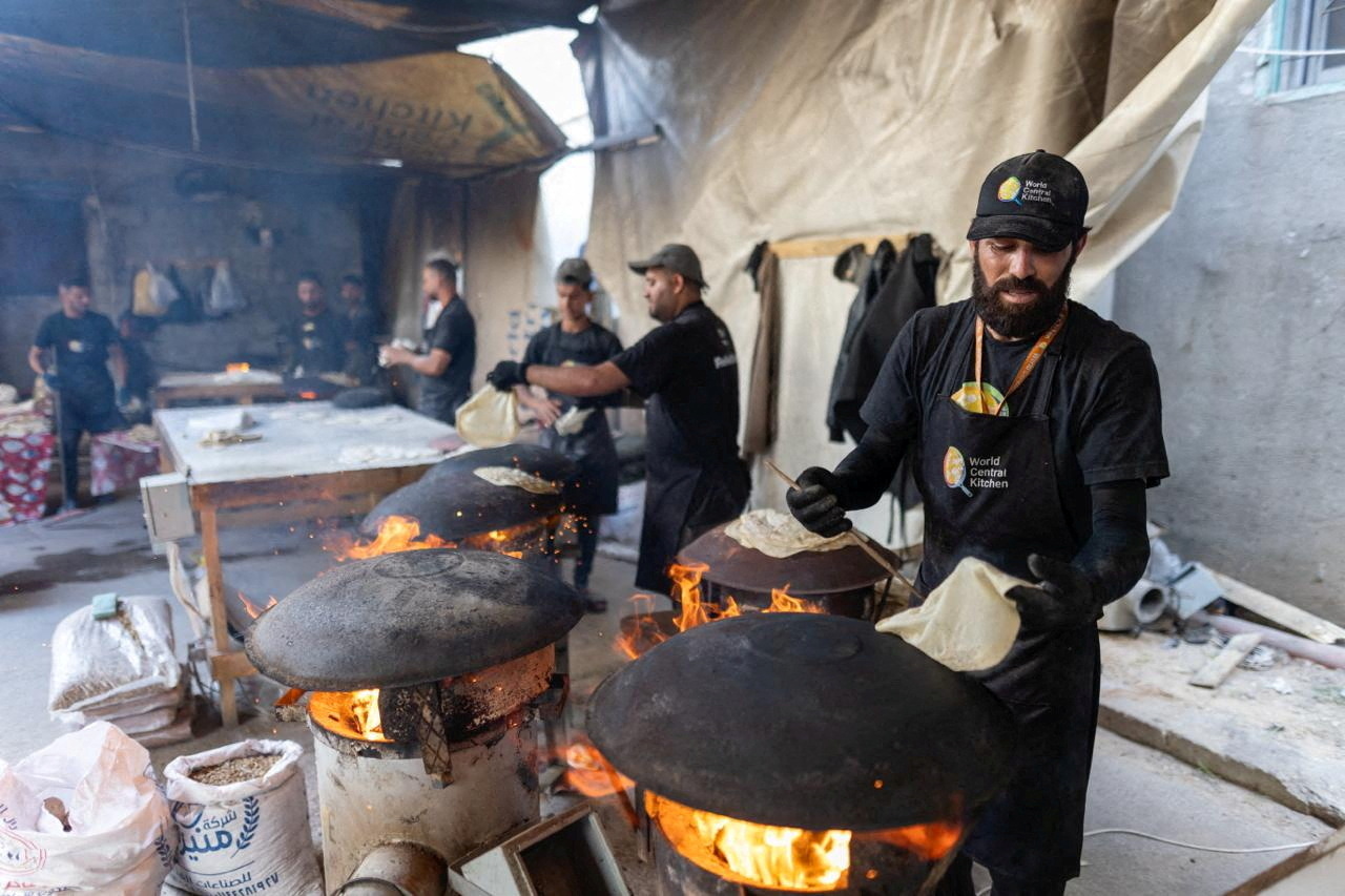 World Central Kitchen team prepares food as WCK served meals to displaced Palestinians after resuming work in Gaza, amid the ongoing conflict between Israel and Hamas, in this handout picture released on April 30, 2024. 