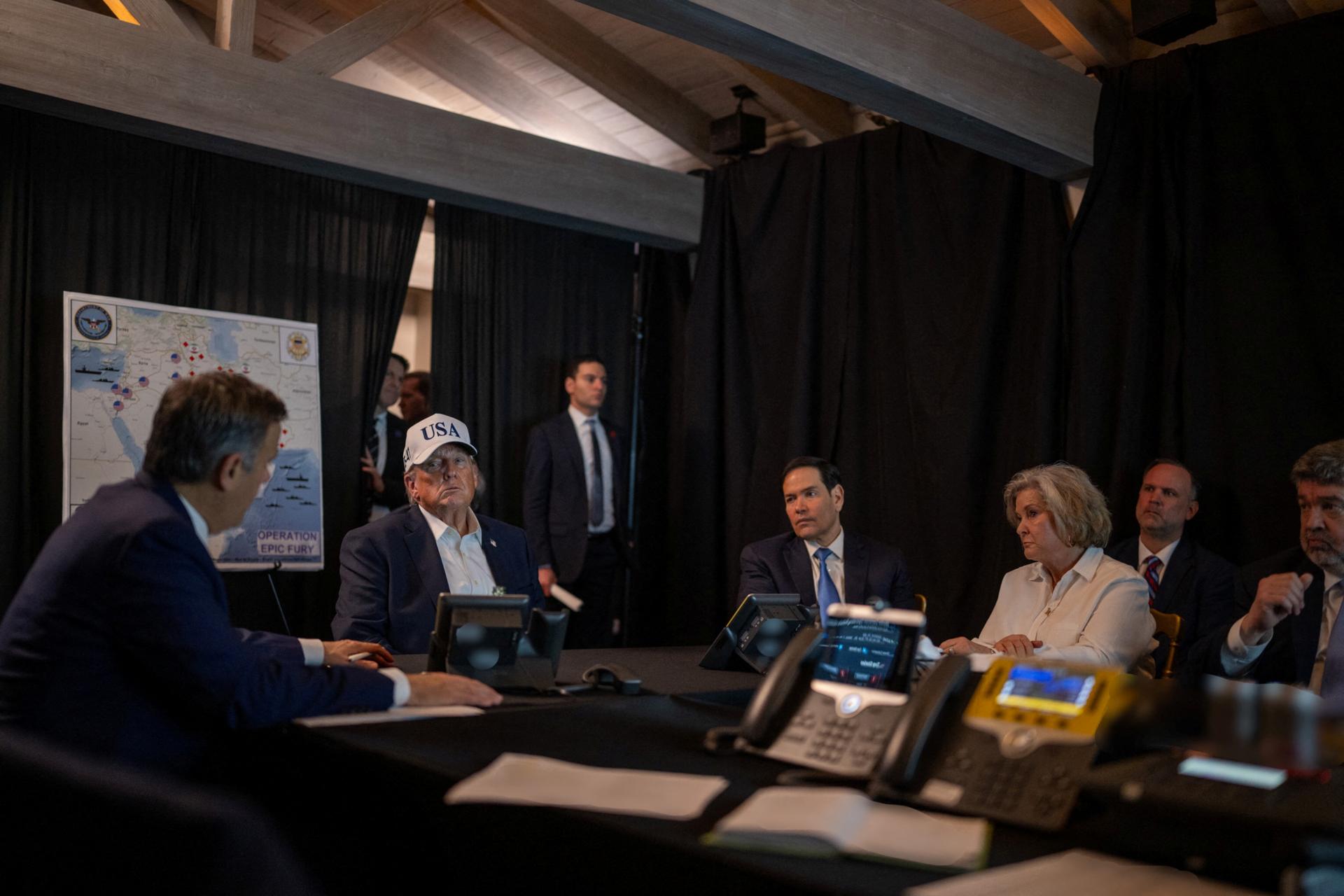 U.S. President Donald Trump speaks with CIA Director John Ratcliffe, White House Chief of Staff Susie Wiles, and Secretary of State Marco Rubio at the Mar-a-Lago resort in Palm Beach, Florida, on February 28, 2026.
