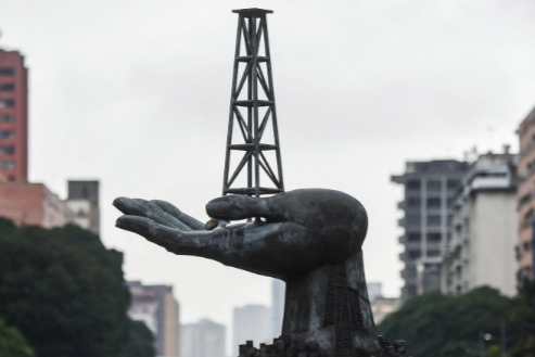 View of the Peace Monument sculpture in front of the Petroleos de Venezuela (PDVSA) headquarters in Caracas, on December 2, 2022. Miguel Zambrano/Getty Images