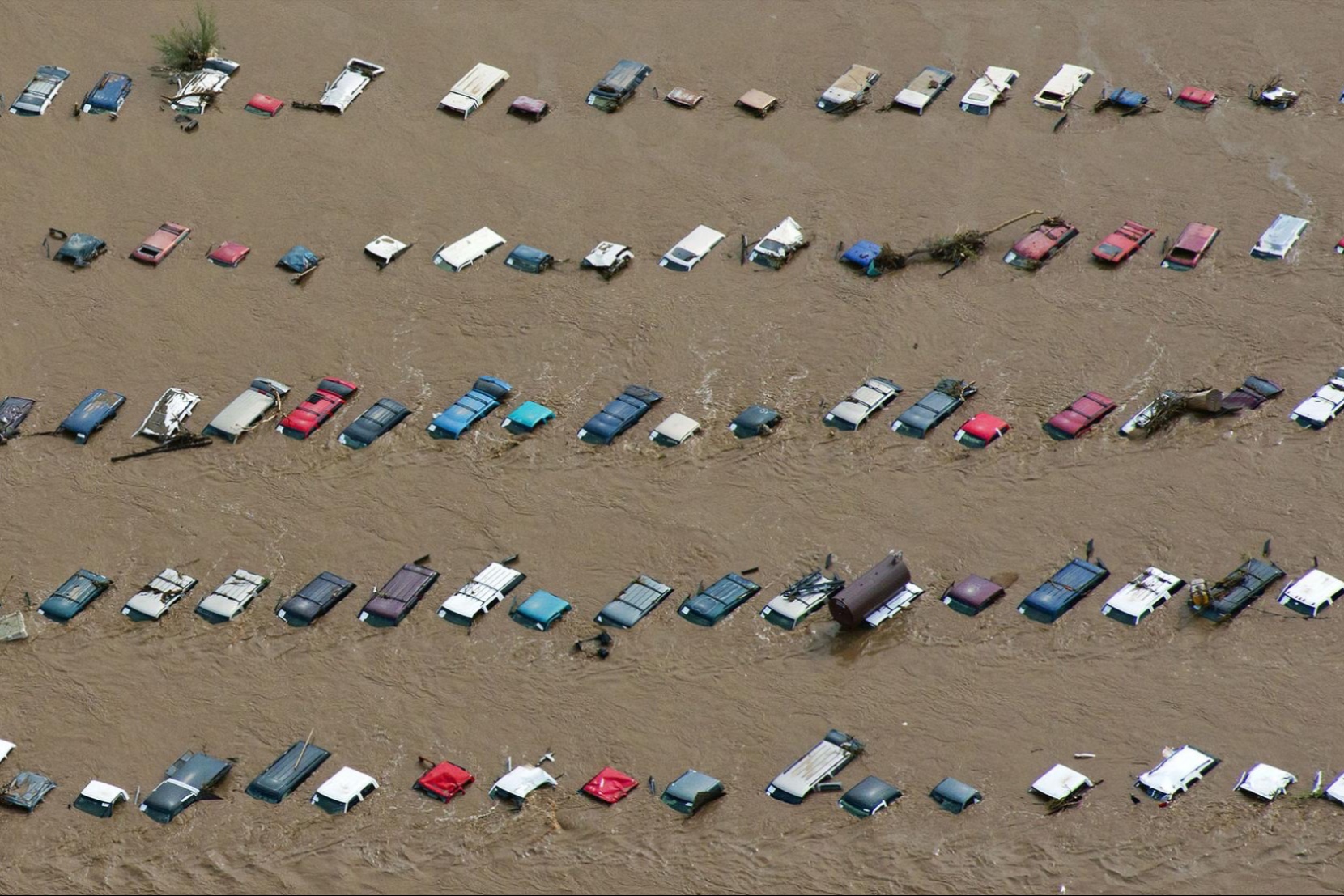 Floods leave cars submerged in water.