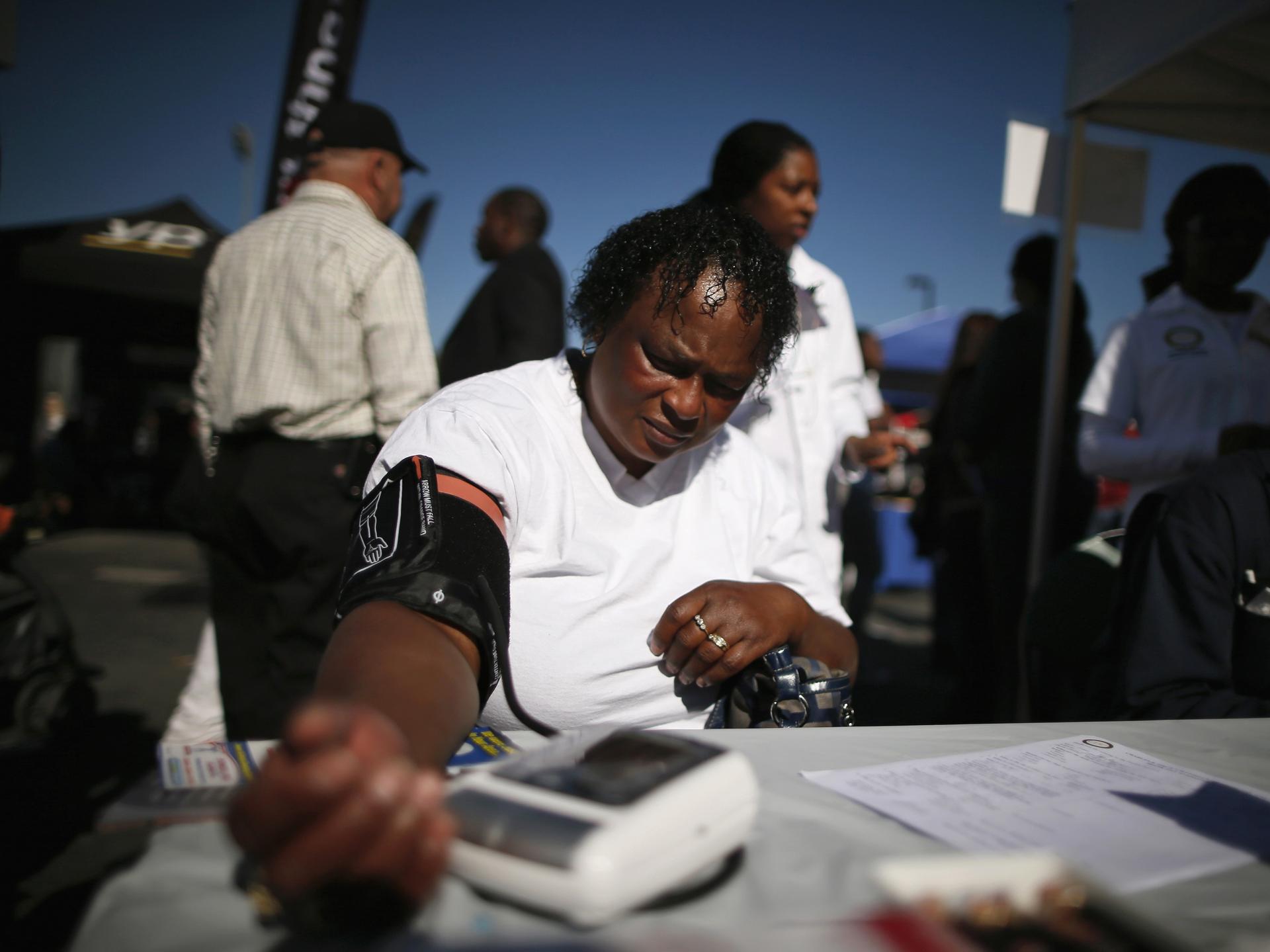 Bernita Jackson, 51, has her blood pressure measured at an event to inform people about the Affordable Care Act, in Los Angeles, California, on November 25, 2013.