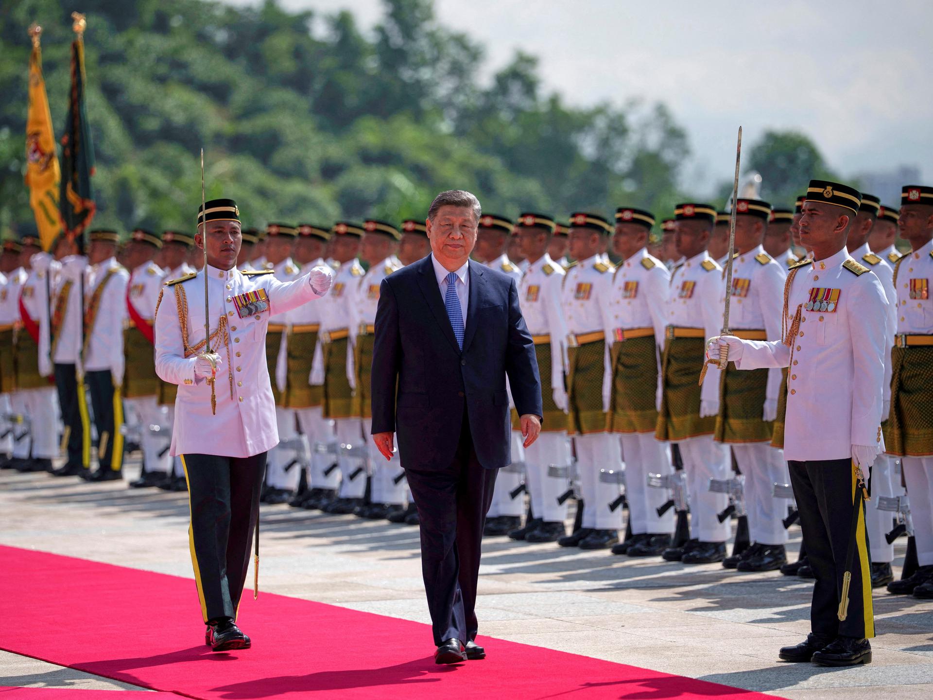 Chinese President Xi Jinping inspects an honor guard during the official welcoming ceremony at the national palace, in Kuala Lumpur, Malaysia, on April 16, 2025.