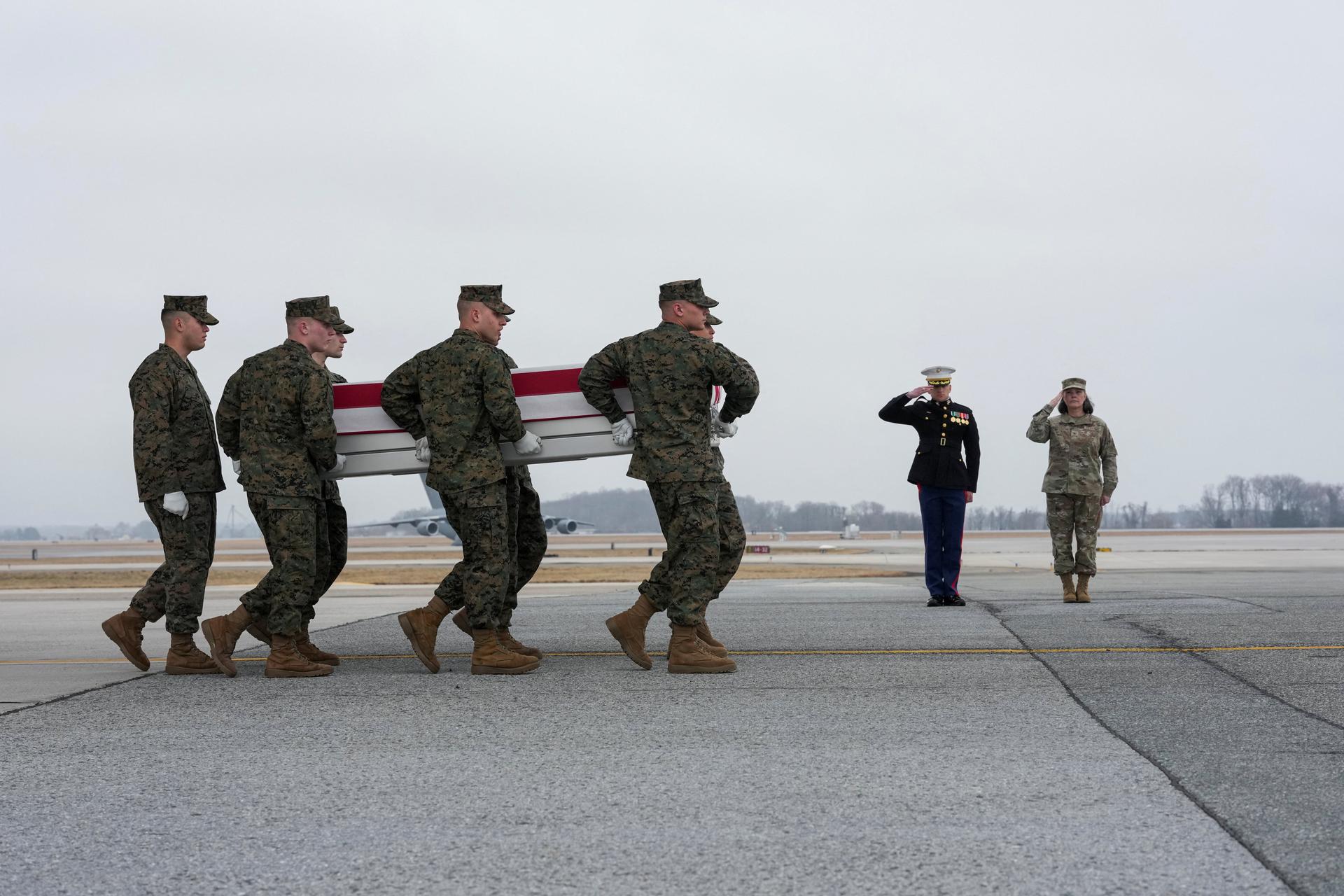 Members of the U.S. military carry out a transfer of the remains of a U.S. Marine Corps lance corporal who died in Saudi Arabia, at Dover Air Force Base in Delaware, on March 4, 2026. 