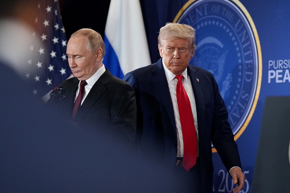 Russian President Vladimir Putin and U.S. President Donald Trump arrive for a press conference at Joint Base Elmendorf-Richardson in Anchorage, Alaska, August 15, 2025.
