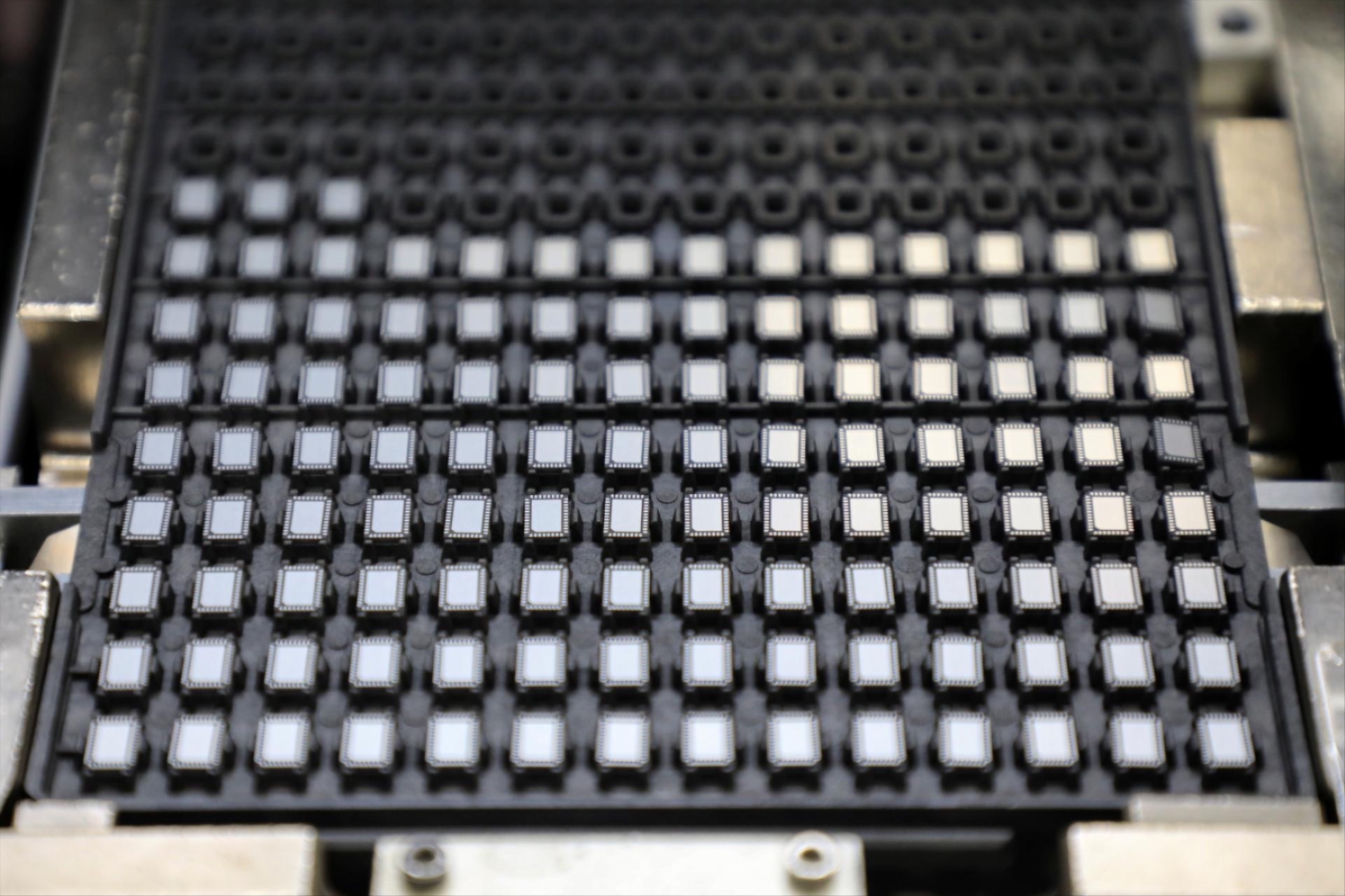 Chips are pictured at semiconductor packaging firm Unisem's plant in Ipoh, Malaysia October 15, 2021.