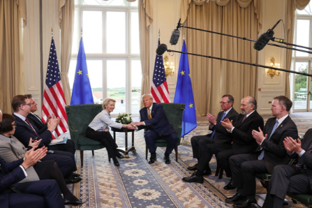 U.S. President Donald Trump shakes hands with European Commission President Ursula von der Leyen as U.S. officials clap after an announcement of a trade deal between the United States and EU, in Turnberry, Scotland, on July 27. Evelyn Hockstein/Reuters