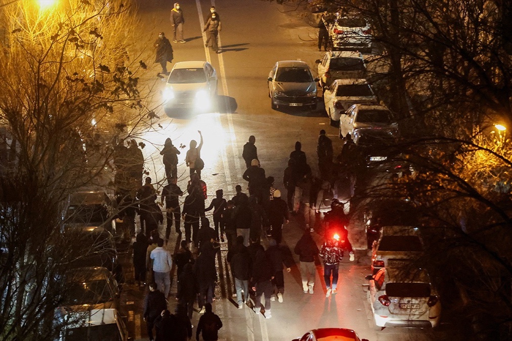 Iranian demonstrators gather in a street during a protest over the collapse of the currency's value, in Tehran, Iran, January 8, 2026.