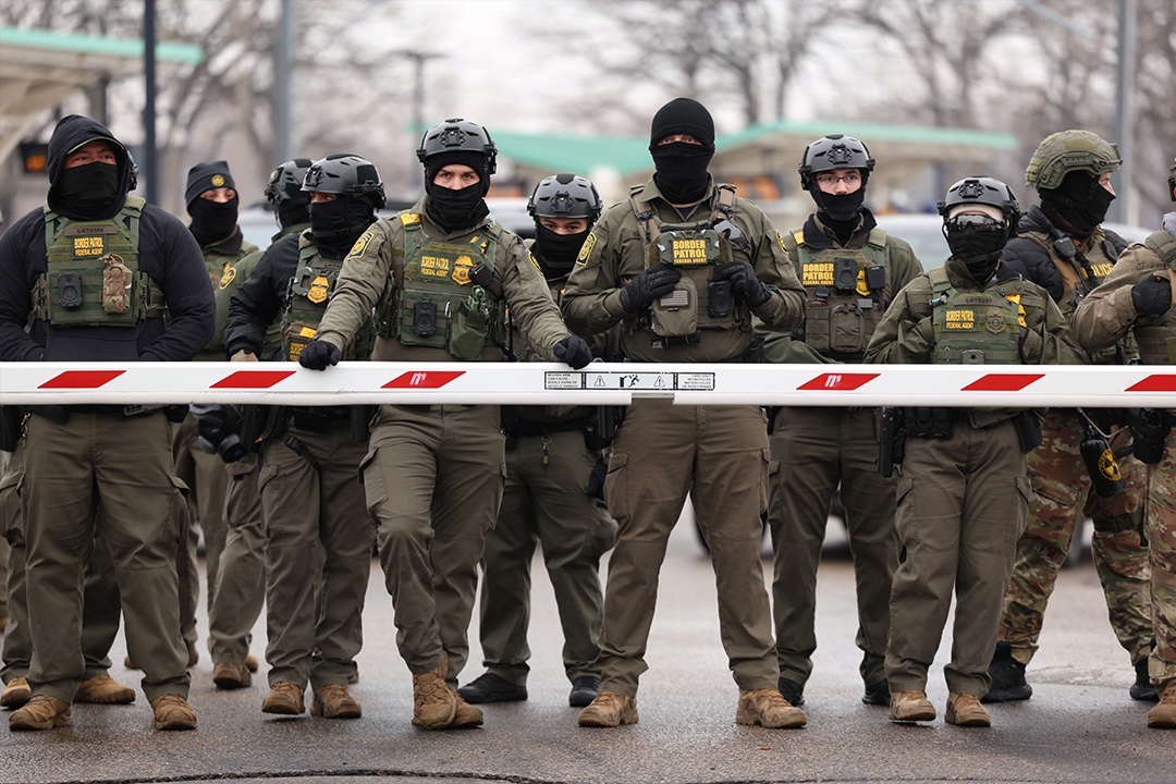 U.S. Border Patrol agents stand guard at the Bishop Henry Whipple Federal Building in Minneapolis, Minnesota, January 8, 2026.