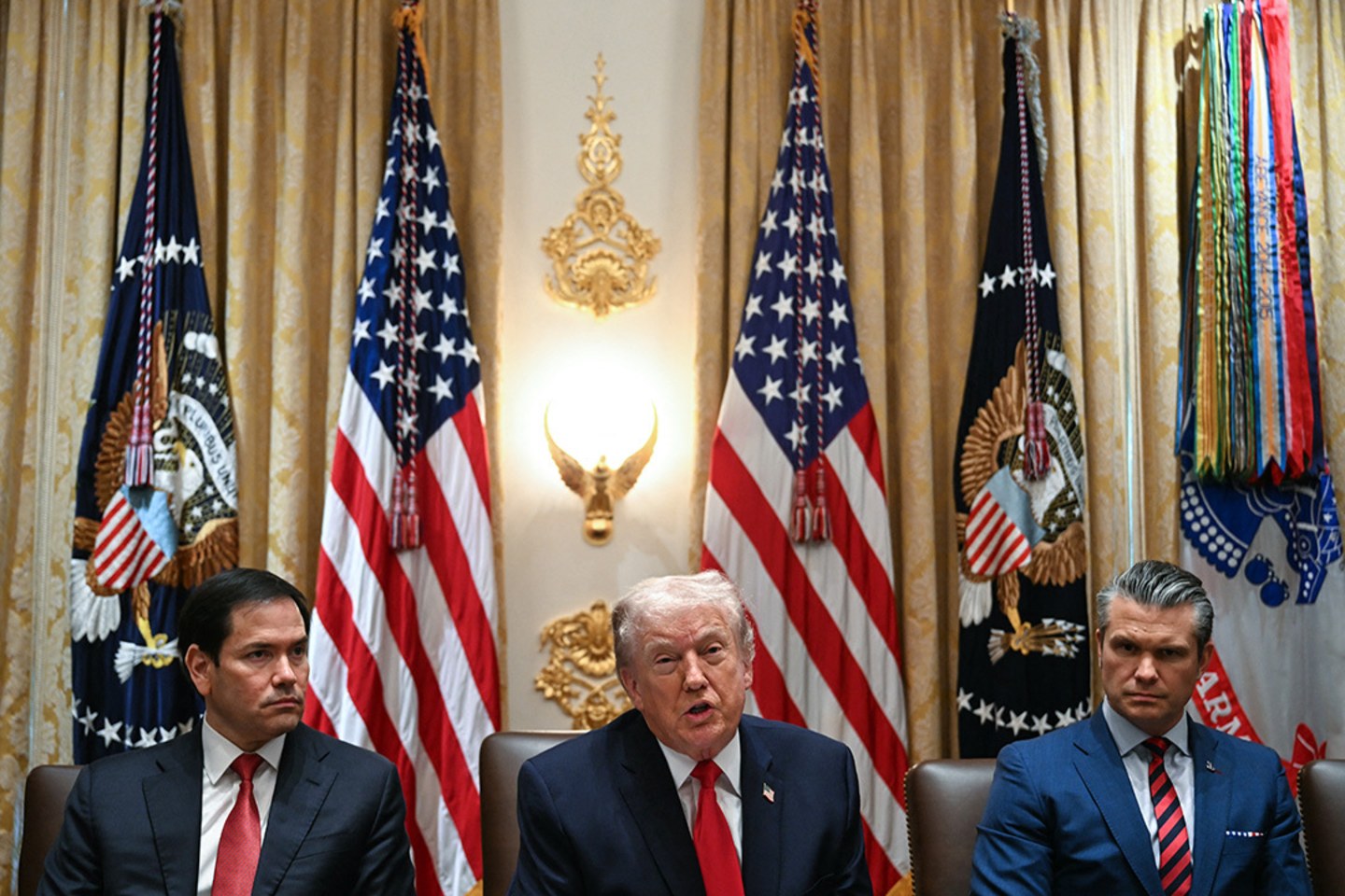 US President Donald Trump speaks alongside Secretary of State Marco Rubio and Defense Secretary Pete Hegseth on January 29, 2026.