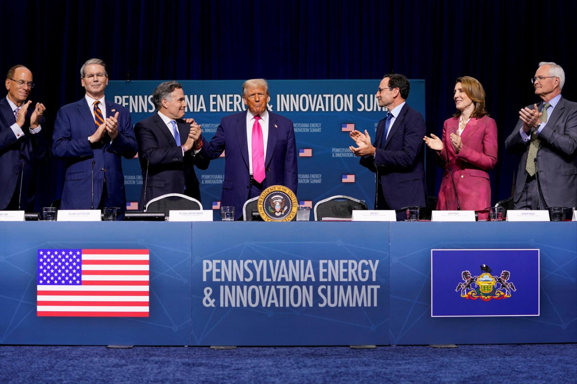 Chairman and CEO of BlackRock Larry Fink, U.S. Treasury Secretary Scott Bessent, Senator Dave McCormick (R-PA), Chief Operating Officer of Blackstone Jon Gray, Alphabet & Google President and Chief Investment Officer Ruth Porat and CEO of Exxon Mobil Corp REUTERS/Nathan Howard