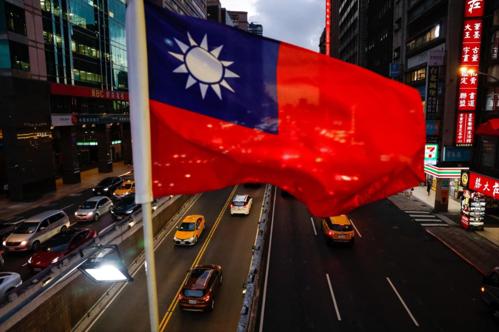 A Taiwan flag can be seen on an overpass ahead of National Day celebrations in Taipei, Taiwan, October 8, 2025.
