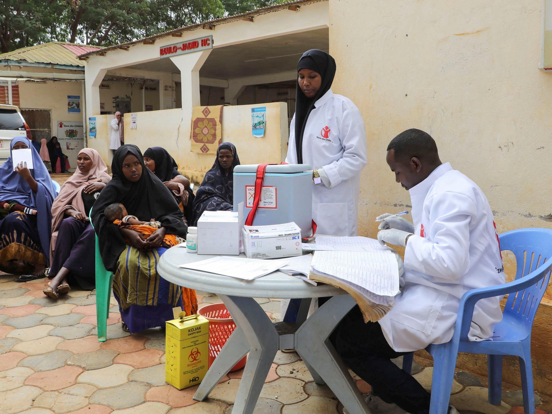 A nurse from Save the Children prepares vaccinations for internally displaced Somali children, in Baidoa, Somalia, on June 25, 2025.