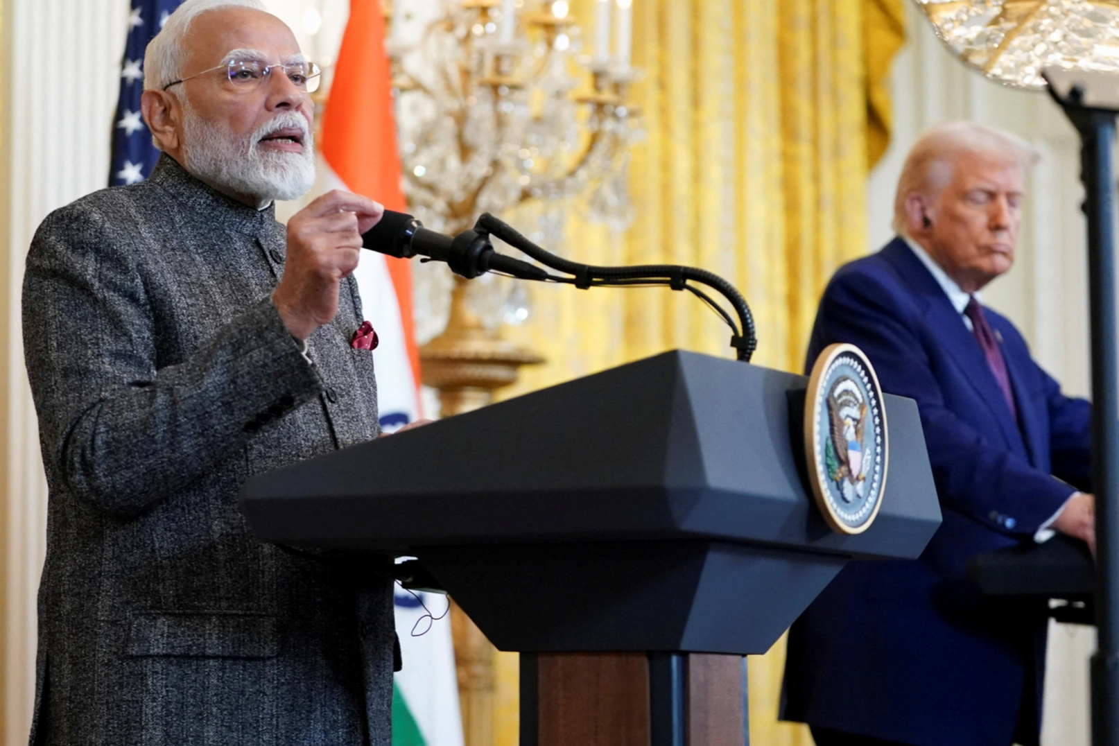 U.S. President Donald Trump listens as Indian Prime Minister Narendra Modi speaks during a joint press conference at the White House in Washington, D.C., U.S., February 13, 2025. REUTERS/Nathan Howard
