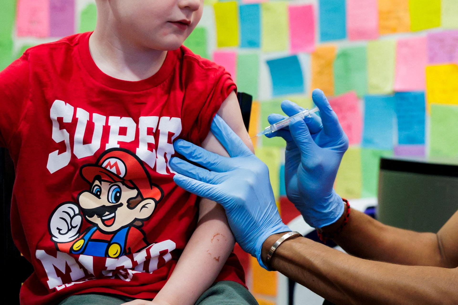 A child receives a vaccine