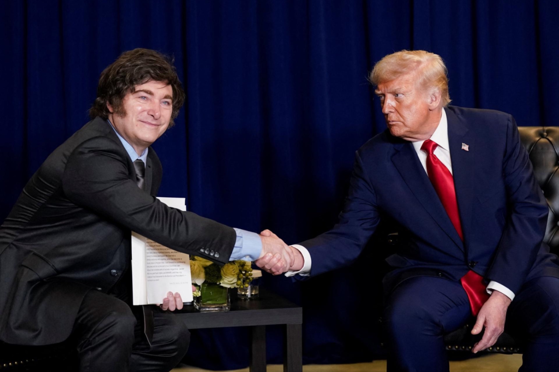 U.S. President Donald Trump shakes hands with Argentina's President Javier Milei as they meet during the 80th United Nations General Assembly, in New York City, September 23, 2025.