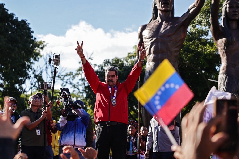 President Nicolás Maduro of Venezuela greets his supporters during a rally to commemorate Indigenous Resistance Day on October 12, 2025 in Caracas, Venezuela.