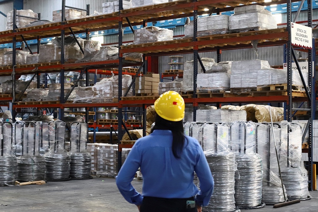 An employee works at Trefilados Inoxidables de México, which exports manufactured aluminum, nickel alloys, and stainless steel wire to the United States, in Tlaxcala, Mexico.