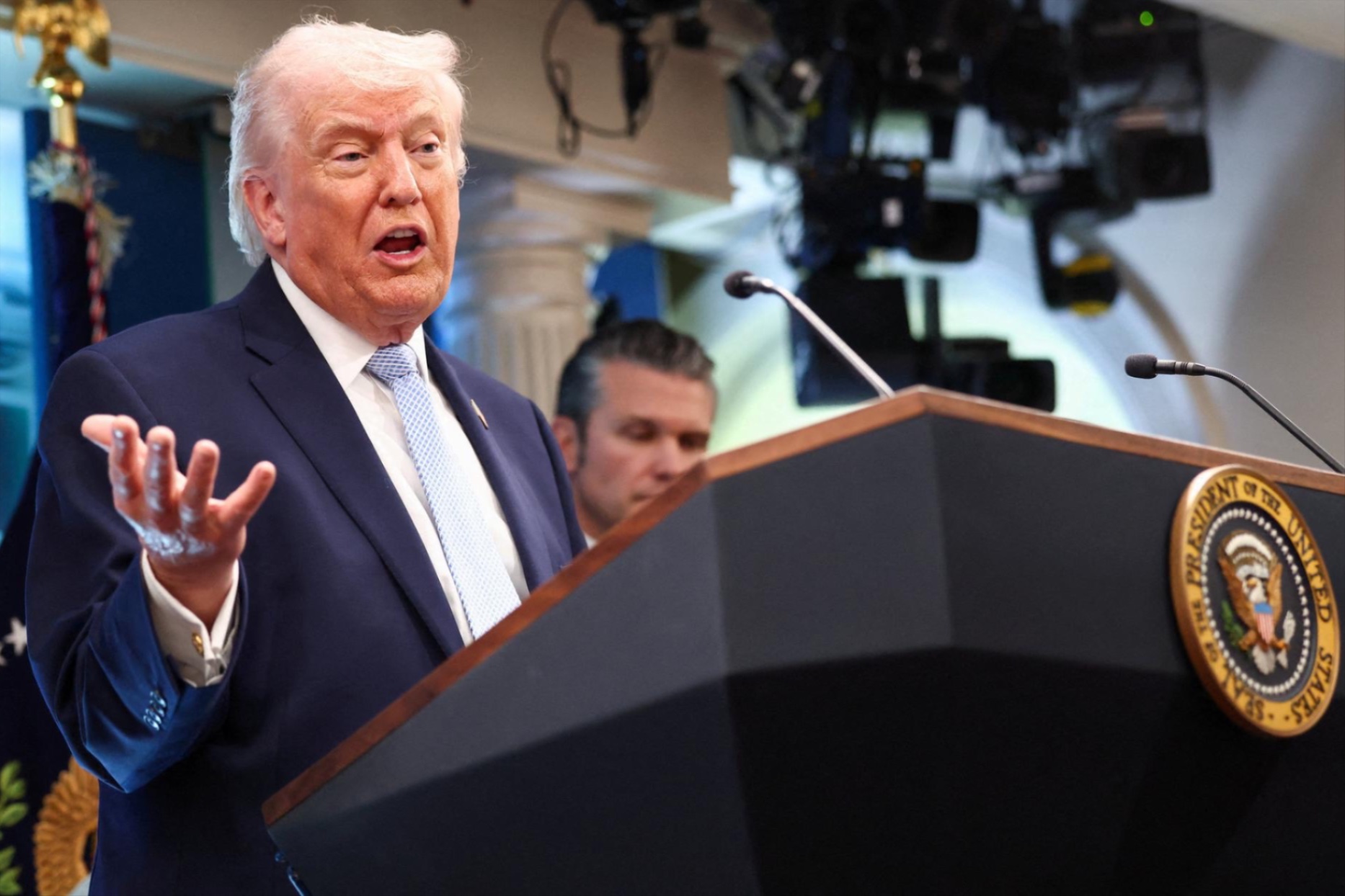 President Donald Trump, flanked by Secretary of Defense Pete Hegseth, speaks during a press conference in the James S. Brady Press Briefing Room at the White House in Washington, D.C., U.S., April 6, 2026.