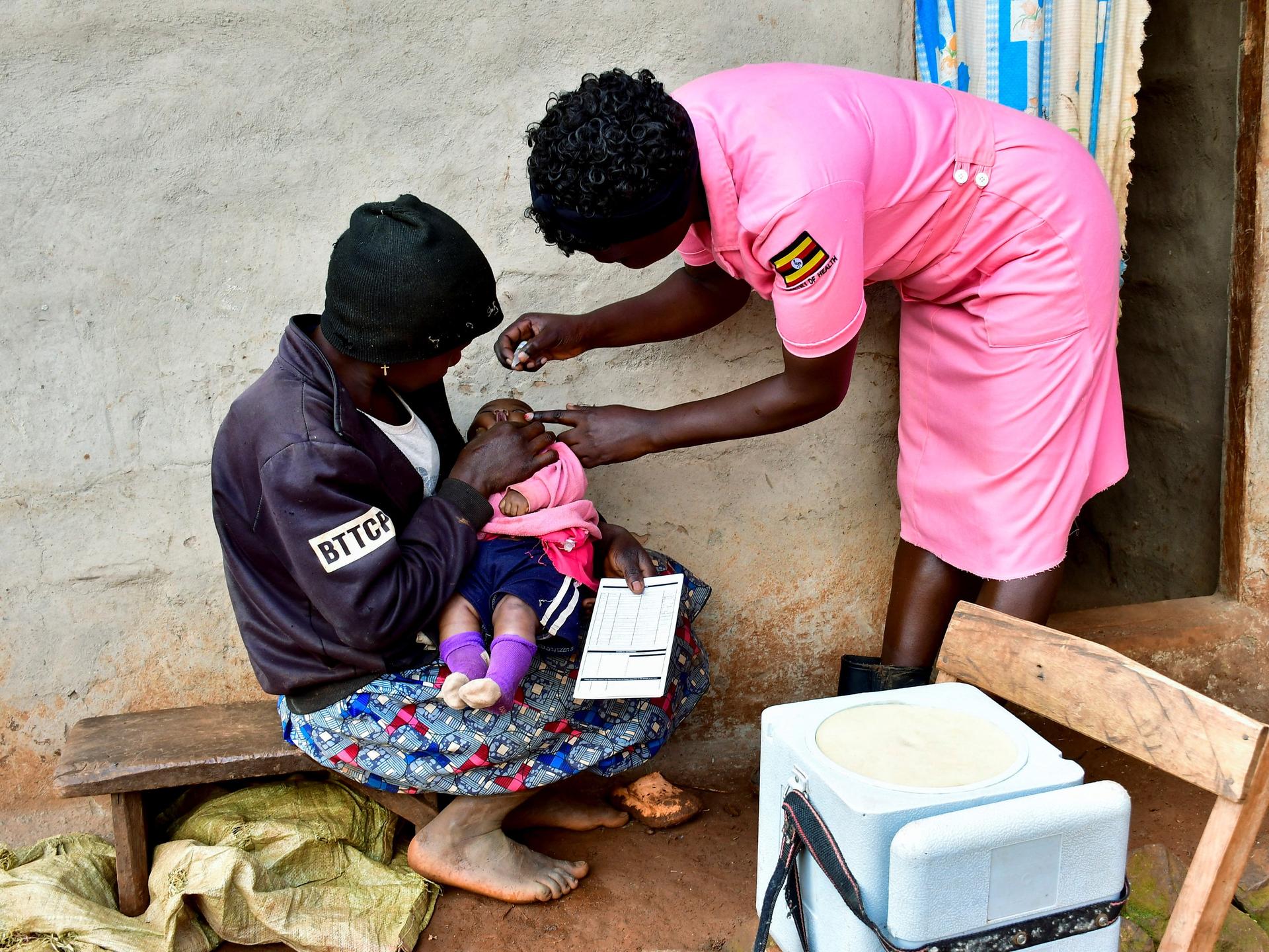 A nurse administers polio vaccine to a child during her community outreach program, in Mushelusi village, in Bulambuli district, Uganda, on September 10, 2025.