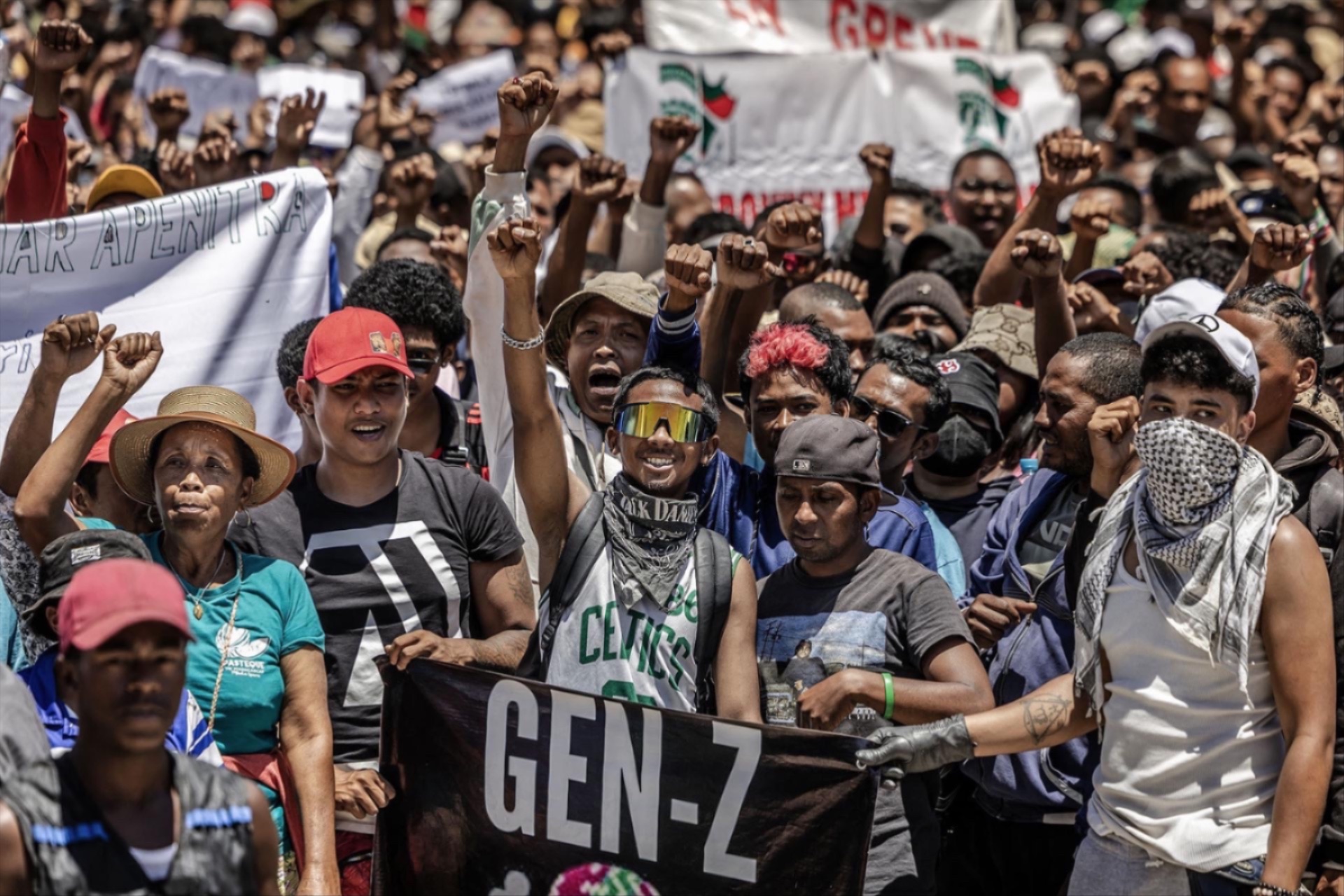 Demonstrators hold banners as they gather outside City Hall in Antananarivo, Madagascar, October 13, 2025.