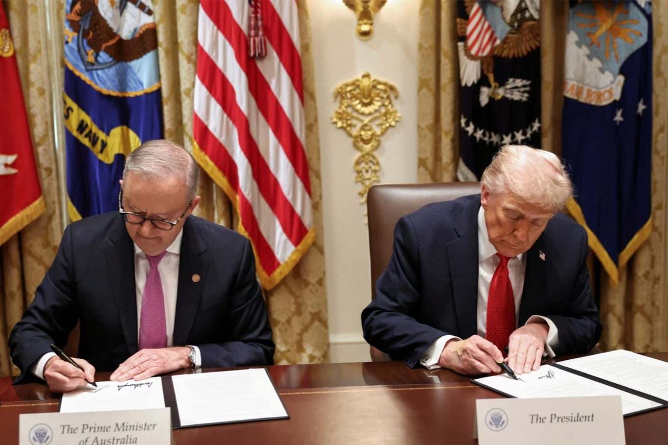 U.S. President Donald Trump and Australia's Prime Minister Anthony Albanese sign an agreement on rare earth and critical minerals during a meeting in the Cabinet Room at the White House, in Washington, D.C., U.S., October 20, 2025. Reuters/Kevin Lamarque