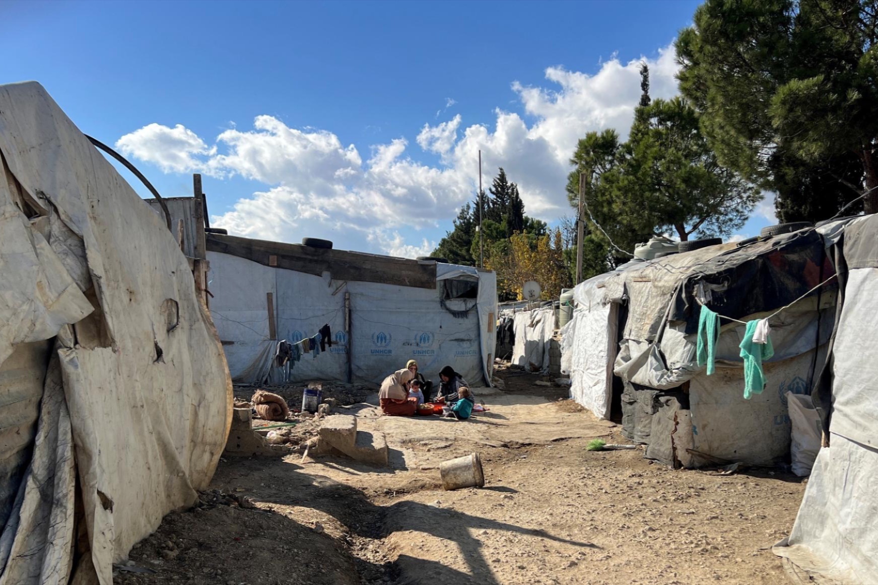 Syrian refugee women peel potatoes at an informal tented settlement in Bar Elias, Bekaa Valley, Lebanon, December 13, 2024.