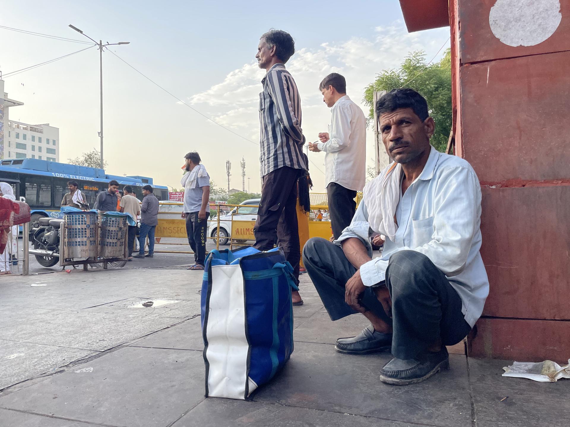 Ramesh Kumar, 45, sits outside a public hospital after seeking affordable tuberculosis treatment, at Ram Manohar Lohia Hospital, in New Delhi, on November 28, 2025.