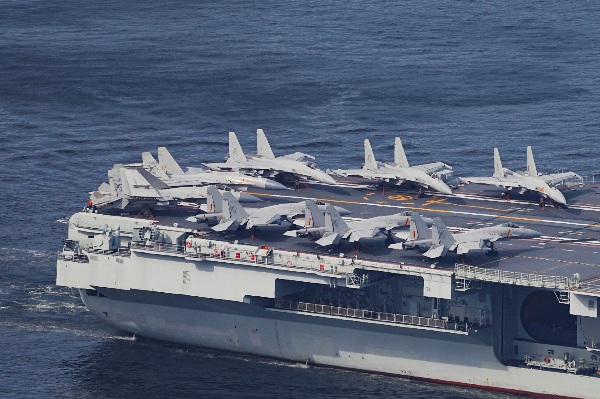 The People's Liberation Army Navy aircraft carrier Shandong, China's first domestically built aircraft carrier, carries fighter aircraft while sailing into Hong Kong for a five-day visit, in Hong Kong, China, July 3, 2025.
