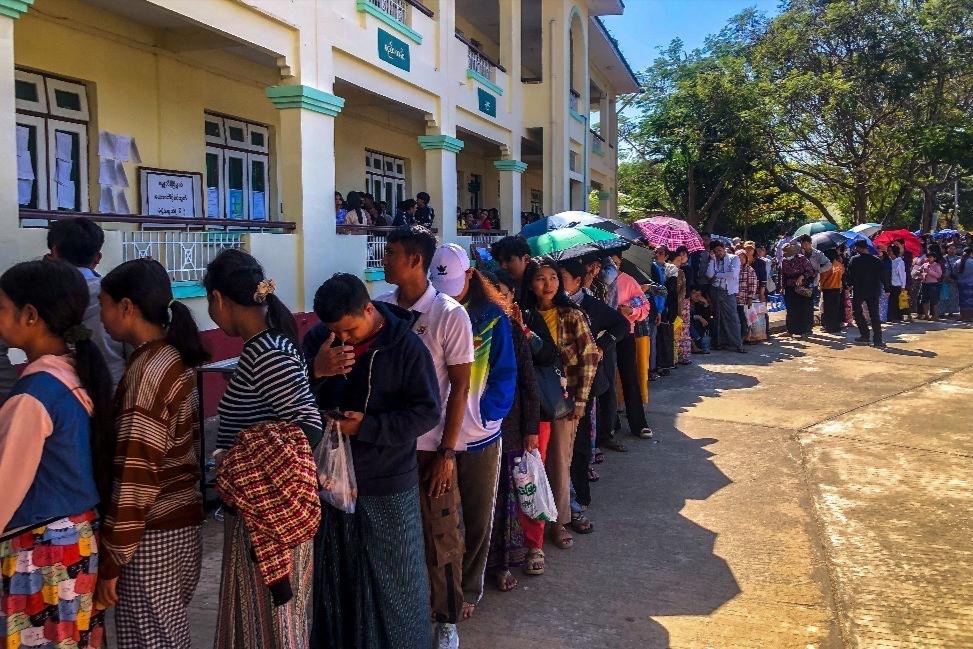 People queue to cast their votes at a polling station during Myanmar's general election in Naypyidaw, Myanmar on December 28, 2025.