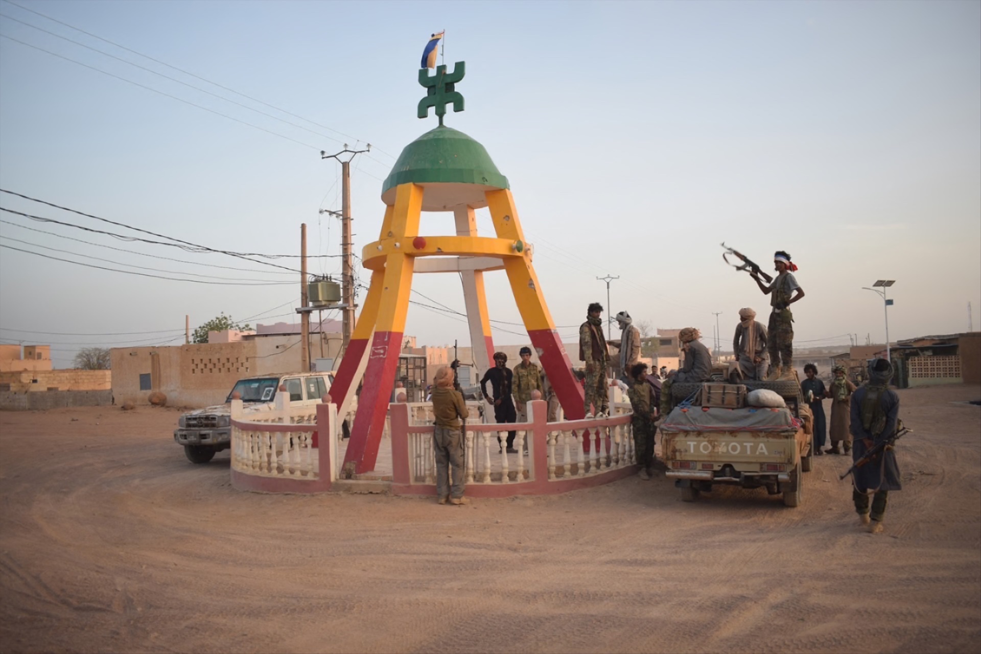 Tuareg rebels of the Azawad Liberation Front (FLA) coalition gather at a statue in Kidal, Mali, on April 26, in the aftermath of attacks on the city. 