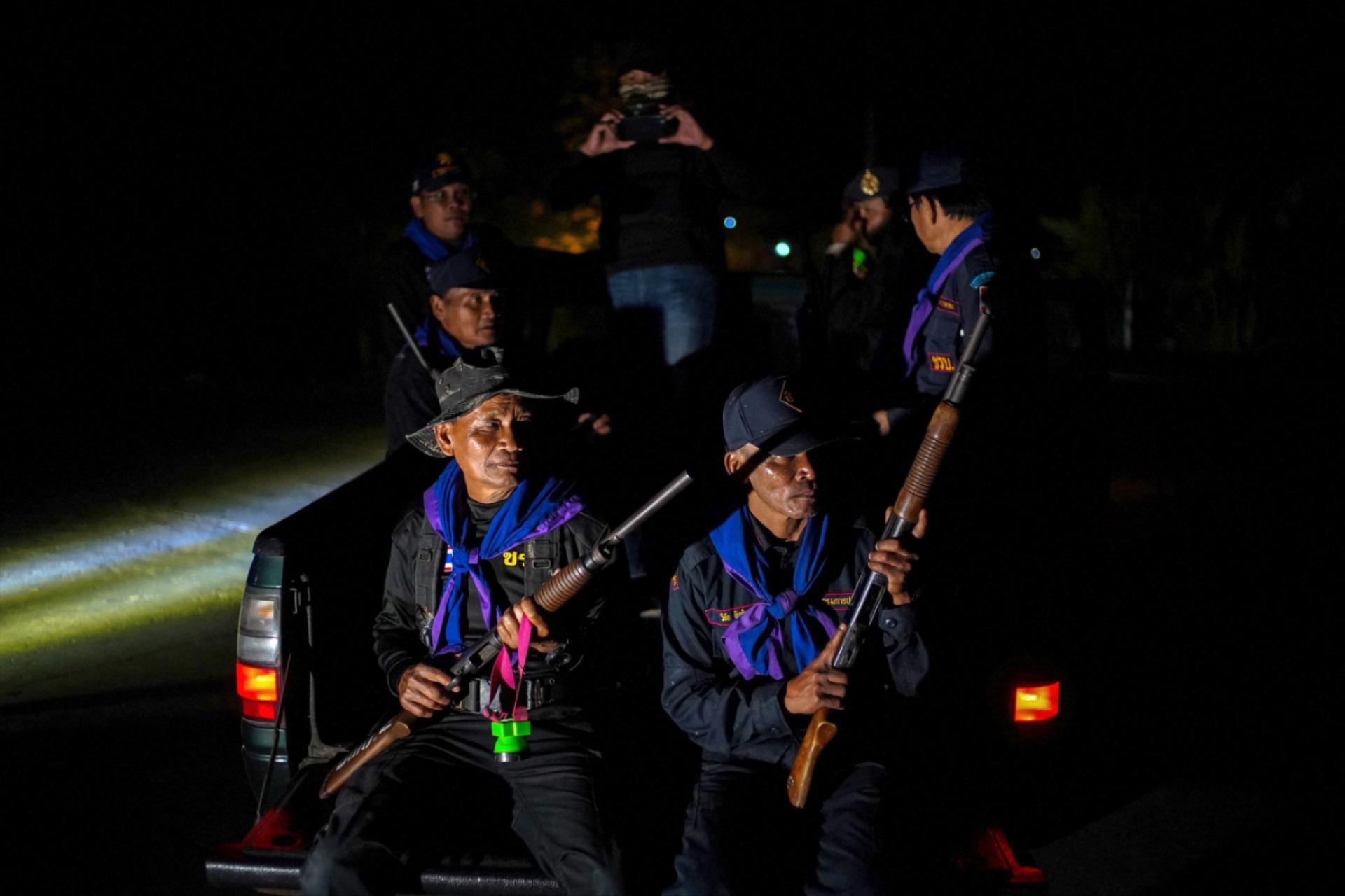 Village security volunteers patrol a village amid deadly clashes between Thailand and Cambodia along a disputed border area, in Buriram province, Thailand, on December 9, 2025.