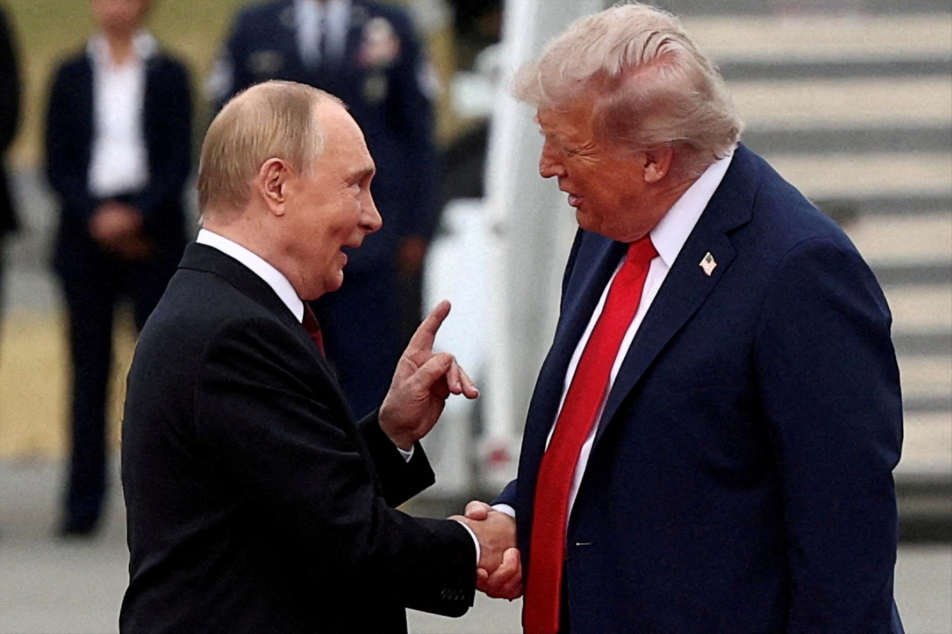 Donald Trump shakes hand with Russian President Vladimir Putin, as they meet to negotiate for an end to the war in Ukraine, at Joint Base Elmendorf-Richardson in Anchorage, Alaska, U.S., August 15, 2025.