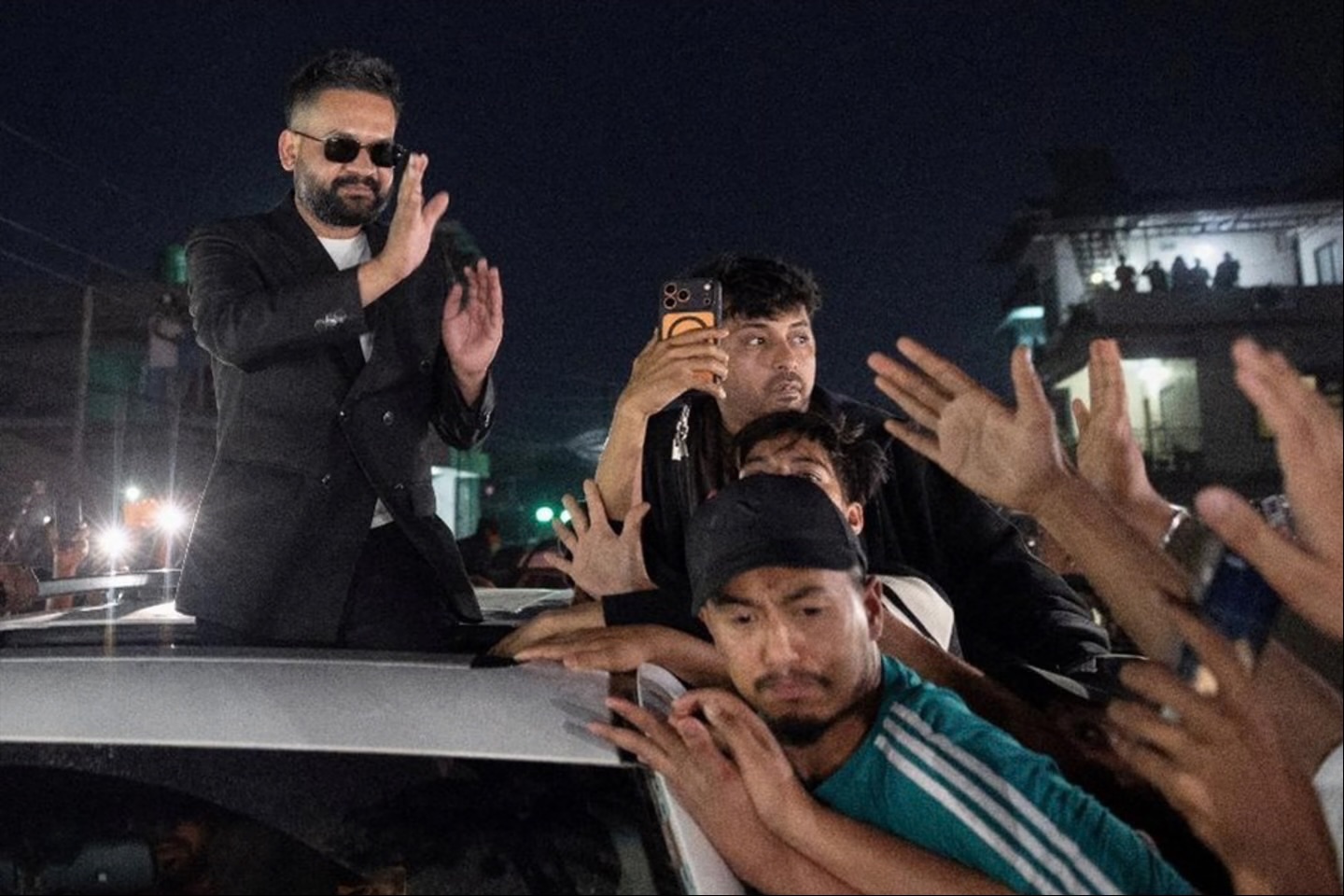 Balendra Shah, a rapper-turned-politician and the prime ministerial candidate for Rastriya Swatantra Party (RSP), greets his supporters as he celebrates after winning the election in Damak, Nepal, on March 7, 2026.