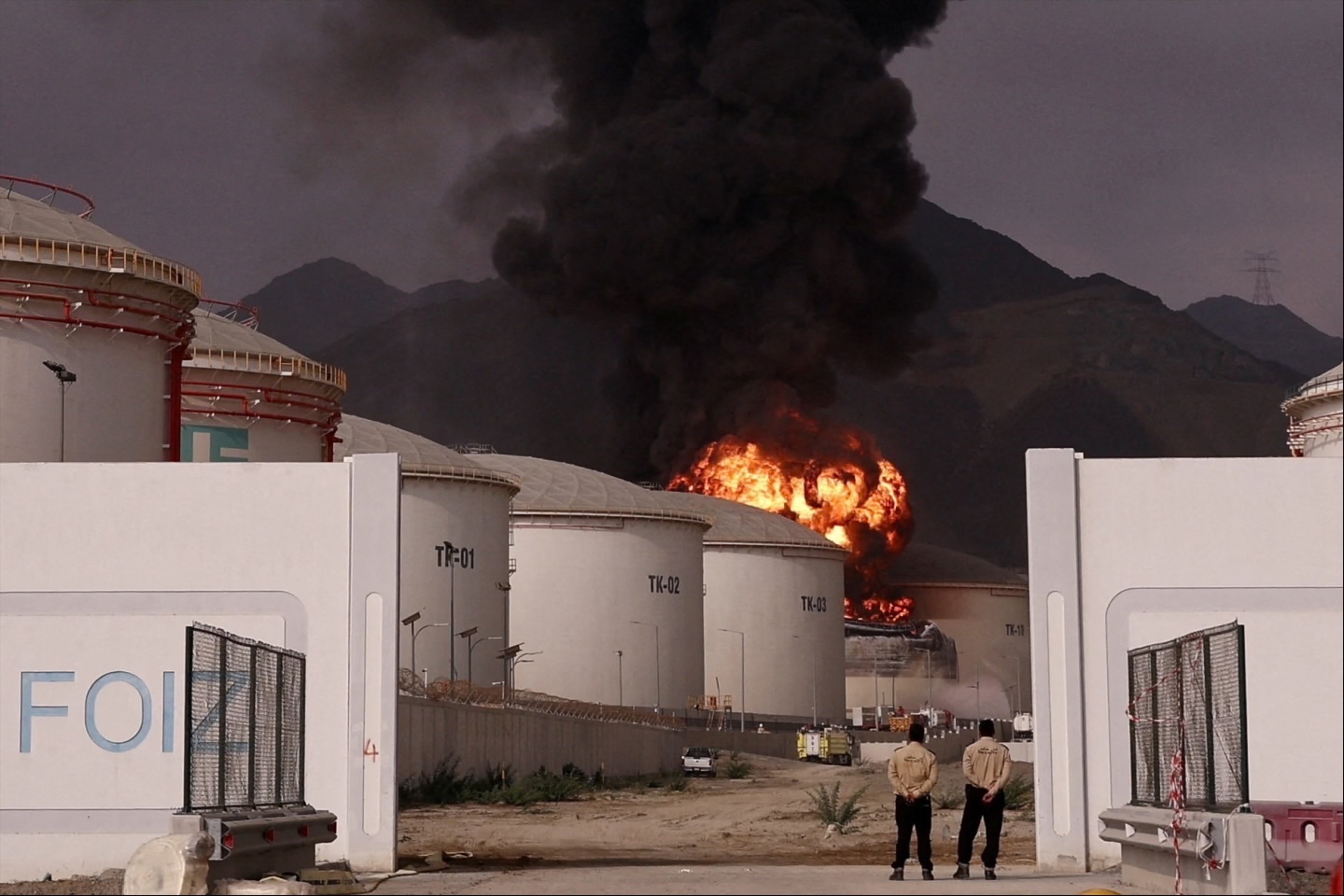 Fire and smoke rise in the Fujairah oil industry zone, caused by debris after interception of a drone by air defenses, according to the Fujairah media office, amid the U.S.-Israel conflict with Iran, in Fujairah, United Arab Emirates, March 4, 2026. 