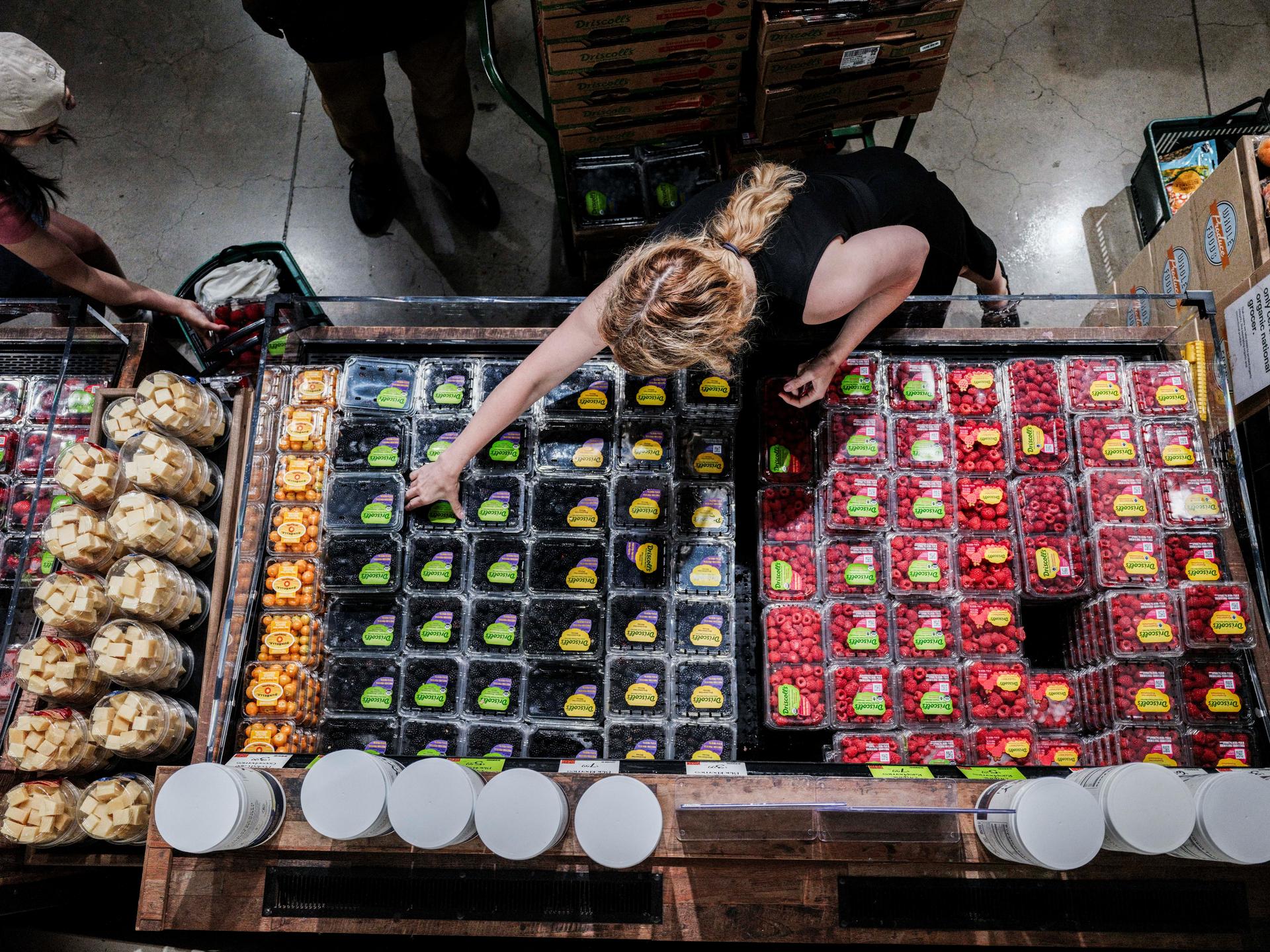 People shop for groceries at a store in New York City, New York, on July 15, 2025.
