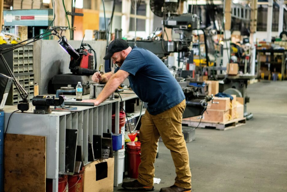  A worker machines a screed tower link at the Calder Brothers' facility in Taylors, South Carolina, U.S., July 19, 2021. Picture taken July 19, 2021. Brandon Granger/Calder Brothers Corporation/Handout via REUTERS