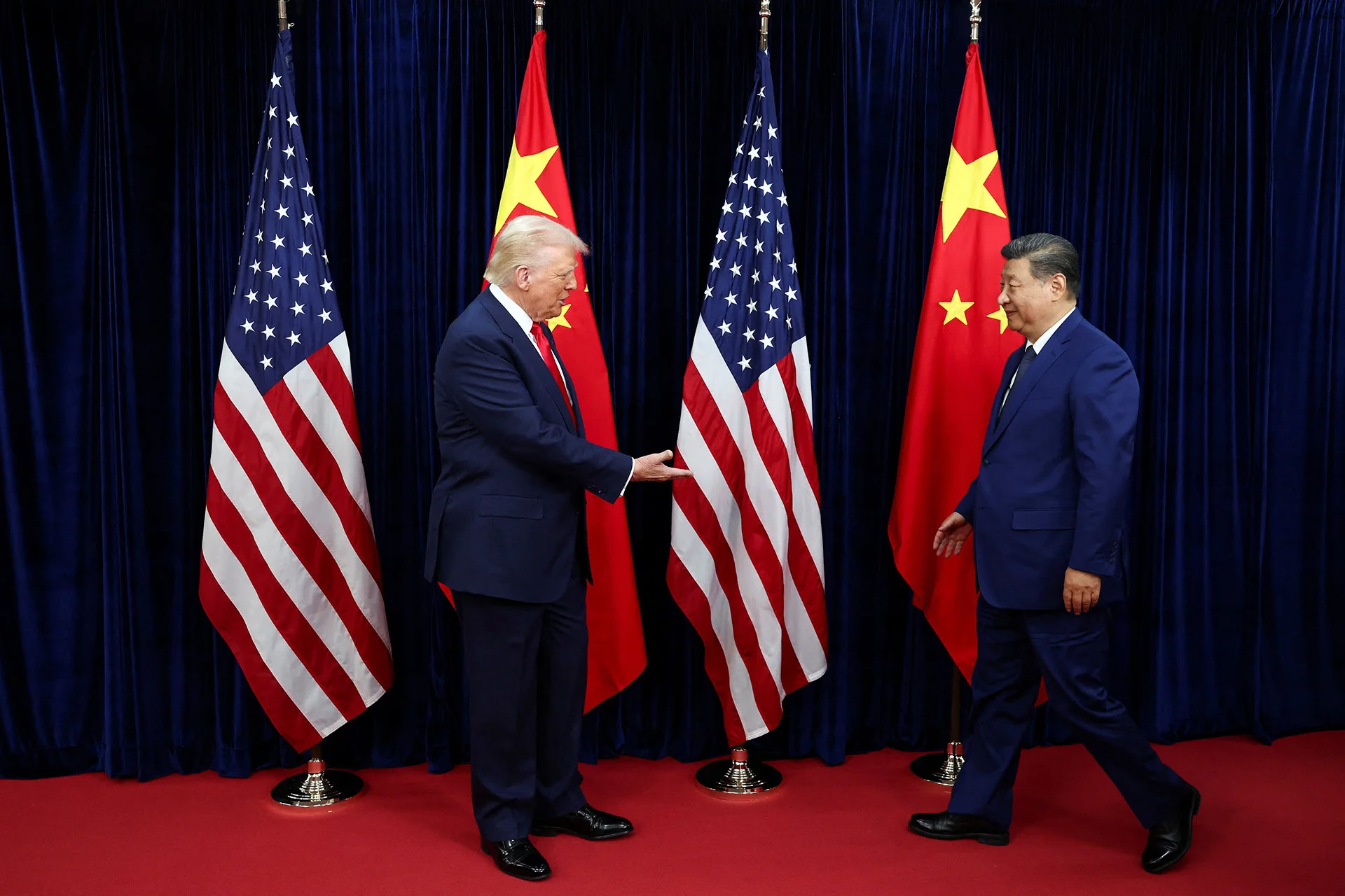 U.S. President Donald Trump extends his hand to greet Chinese President Xi Jinping on the sidelines of the Asia-Pacific Economic Cooperation (APEC) summit in Busan, South Korea, on October 30, 2025. (Evelyn Hockstein/Reuters)