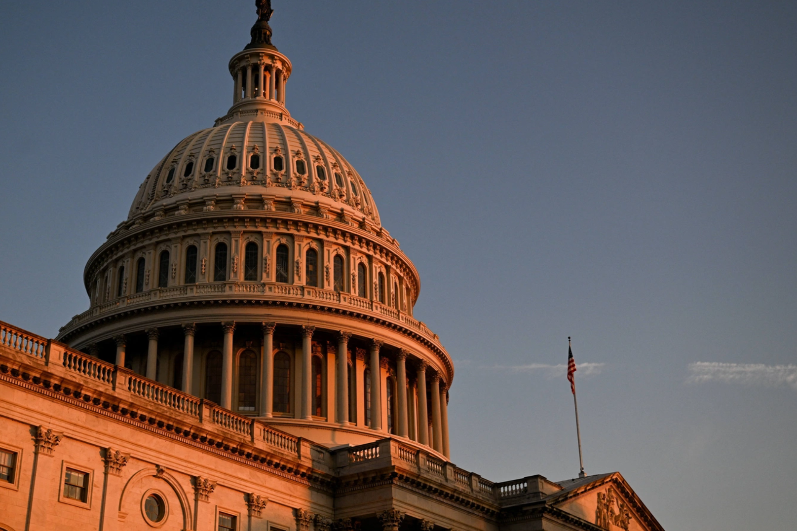 A U.S. flag is displayed near the U.S. Capitol building, in Washington, D.C., U.S., July 3, 2025. REUTERS/Annabelle Gordon