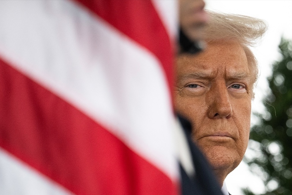 President Donald Trump waits outside of the West Wing at the White House in Washington, DC, February 11, 2025.